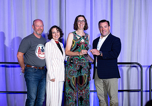 Wendy Molaska, MD, FAAFP accepting the POY Award